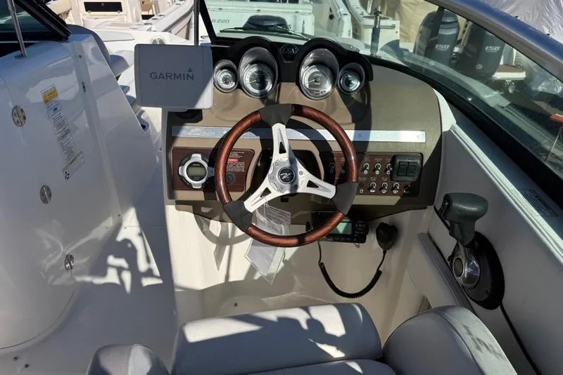Slide: The Image of Steering console of a 2012 Sea Ray 260 Sundeck with Garmin navigation system. - 13