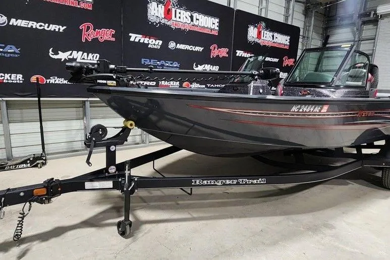 Slide: The Image of 2023 Ranger VS1782SC Reata boat on trailer in showroom setting. - 3