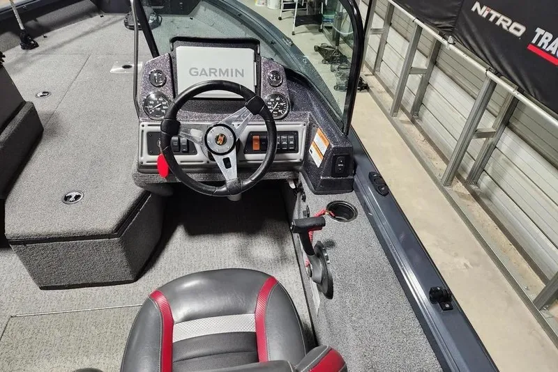 Slide: The Image of 2023 Ranger VS1782SC Reata boat cockpit with Garmin display and steering wheel. - 4