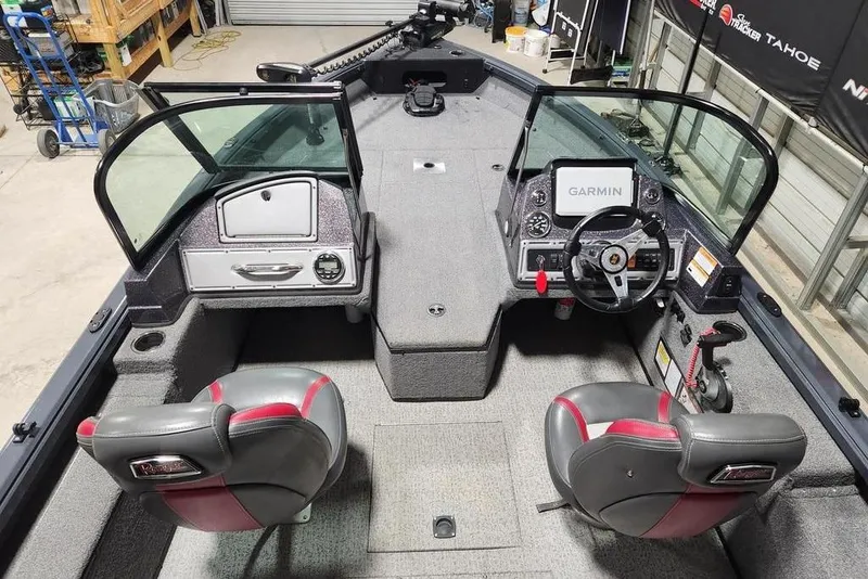 Slide: The Image of 2023 Ranger VS1782SC Reata boat interior with Garmin navigation system and dual seats. - 5