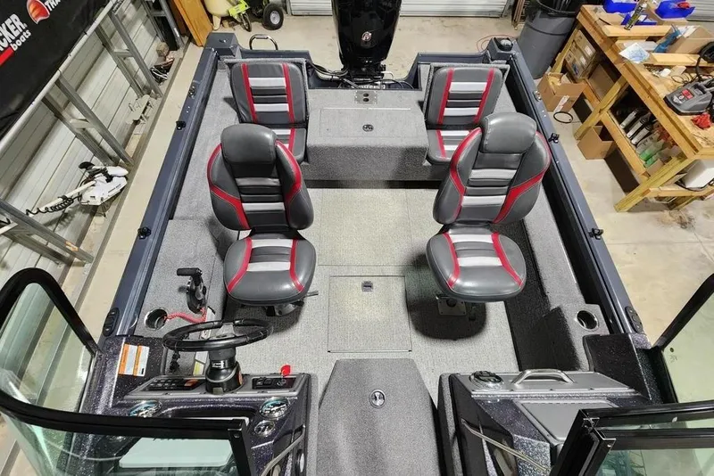 Slide: The Image of 2023 Ranger VS1782SC Reata boat interior with four seats and steering console. - 7