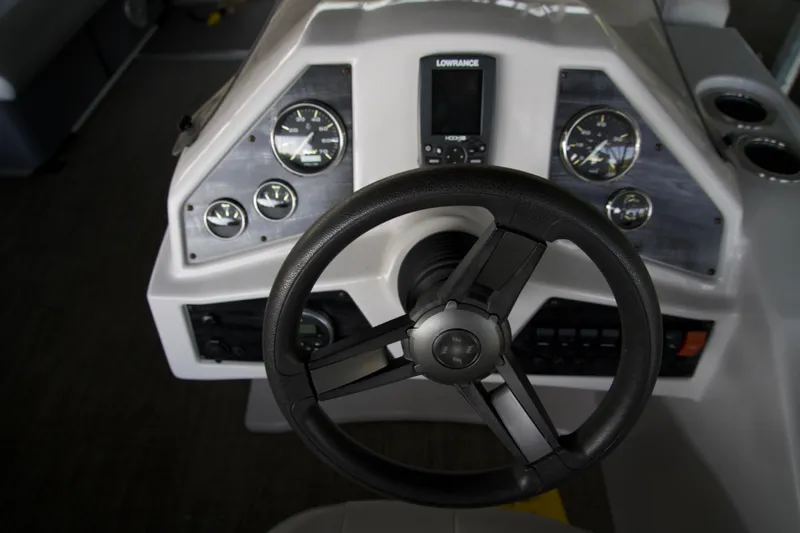 Slide: The Image of Steering console of a 2018 Godfrey Sweetwater20 boat with gauges and controls. - 4
