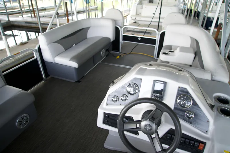 Slide: The Image of Interior of a 2018 Godfrey Sweetwater 20 pontoon boat with steering console and seating. - 5