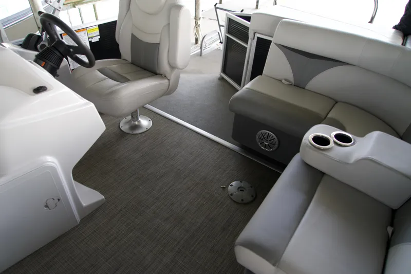 Slide: The Image of Interior of 2018 Godfrey Sweetwater 20 pontoon boat with seating and steering console. - 7