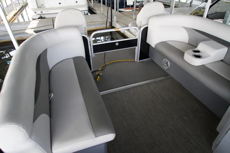Slide: The Image of Interior of a 2018 Godfrey Sweetwater 20 pontoon boat with gray seating and cup holders. - 8