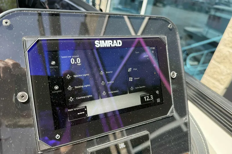 Slide: The Image of Simrad display on 2026 Barletta LUSSO 25UCAT showing navigation and system controls. - 18