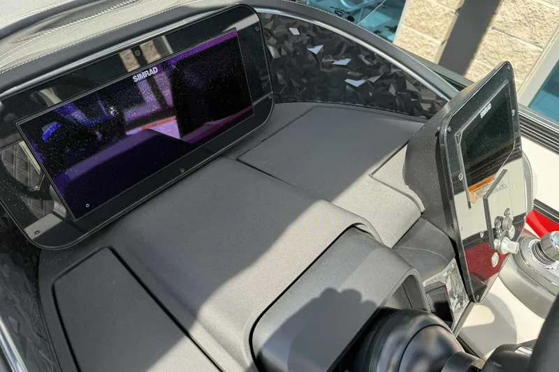 Slide: The Image of Dashboard of 2026 Barletta LUSSO 25UCAT with Simrad displays and modern controls. - 19