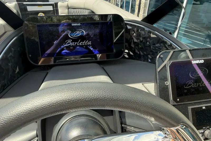 Slide: The Image of Dashboard of 2026 Barletta LUSSO 25UCAT with Simrad displays and steering wheel. - 20