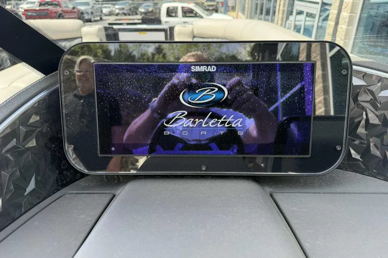 Slide: The Image of Simrad display on 2026 Barletta LUSSO 25UCAT boat dashboard, showing Barletta Boats logo. - 21