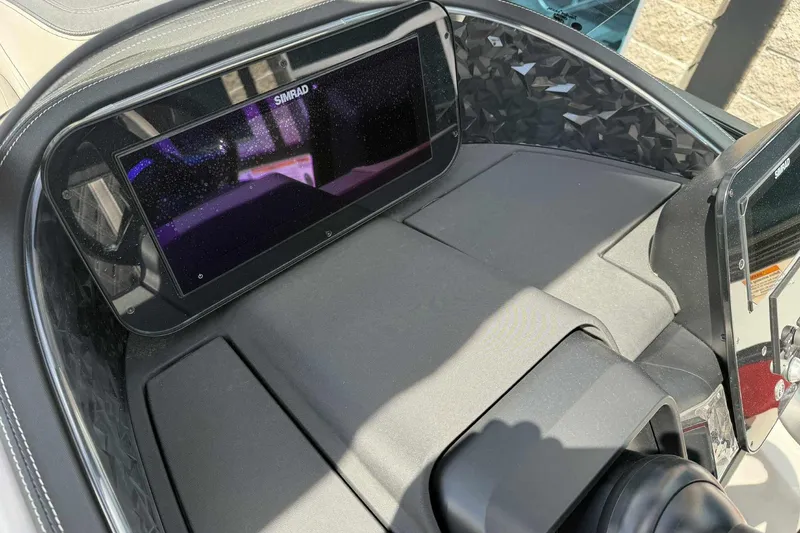 Slide: The Image of 2026 Barletta LUSSO 25UCAT dashboard featuring a Simrad display screen. - 23