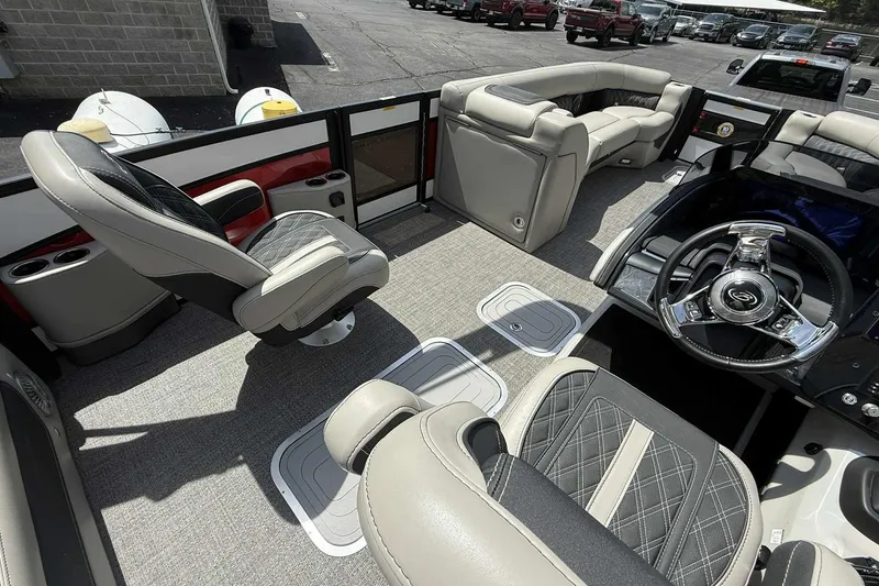 Slide: The Image of Luxurious interior of 2026 Barletta LUSSO 25UCAT pontoon boat with plush seating and modern steering. - 27