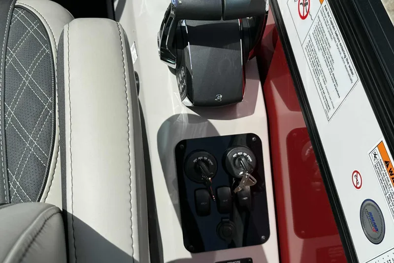 Slide: The Image of Control panel of 2026 Barletta LUSSO 25UCAT boat with keys and throttle. - 30