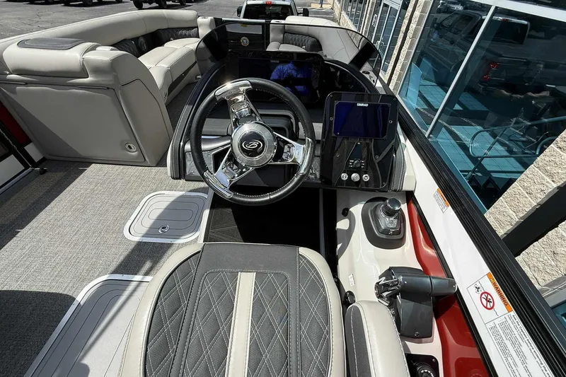 Slide: The Image of Interior view of 2026 Barletta LUSSO 25UCAT boat, featuring luxurious seating and modern controls. - 31