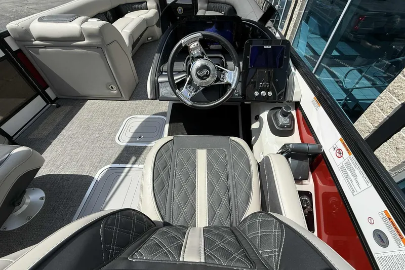Slide: The Image of Luxurious interior of 2026 Barletta LUSSO 25UCAT boat with modern steering and seating. - 32
