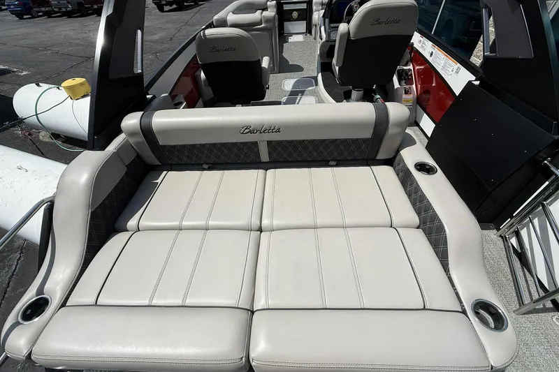 Slide: The Image of Luxurious seating on 2026 Barletta LUSSO 25UCAT pontoon boat, featuring elegant upholstery and cup holders. - 34