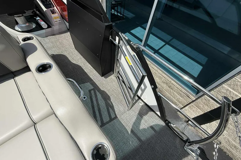 Slide: The Image of Interior view of 2026 Barletta LUSSO 25UCAT boat, featuring seating and open gate. - 35