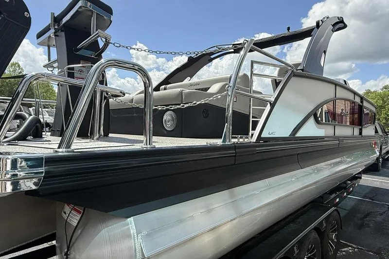 Slide: The Image of 2026 Barletta LUSSO 25UCAT pontoon boat with sleek design and luxurious seating. - 41