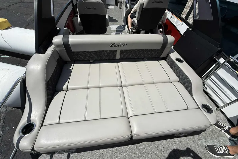 Slide: The Image of 2026 Barletta LUSSO 25UCAT boat interior with luxurious seating and cup holders. - 44