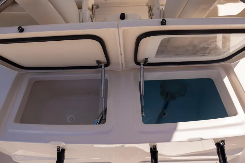 Slide: The Image of Open storage compartments on a 2016 Grady-White Canyon 306 boat. - 10