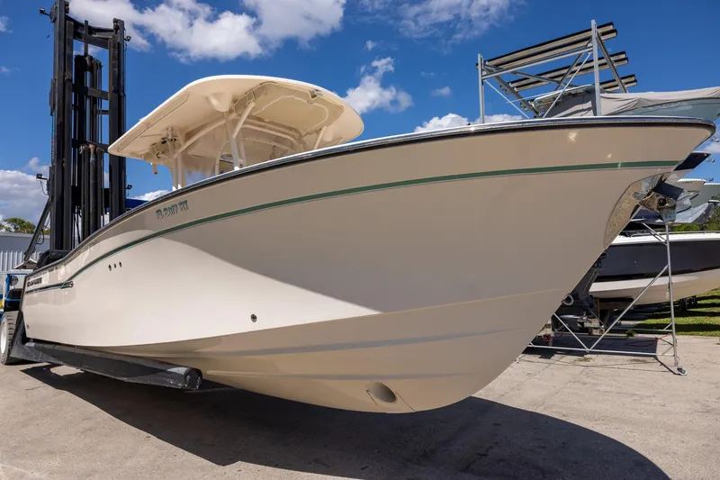 Slide: The Image of 2016 Grady-White Canyon 306 boat on trailer under blue sky. - 2
