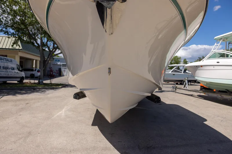 Slide: The Image of 2016 Grady-White Canyon 306 boat hull on display at a marina. - 3