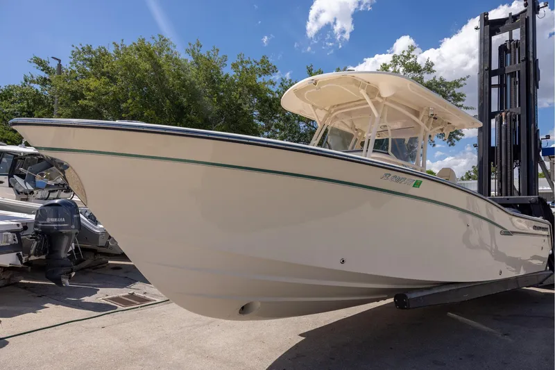 Slide: The Image of 2016 Grady-White Canyon 306 boat on trailer under clear blue sky. - 4