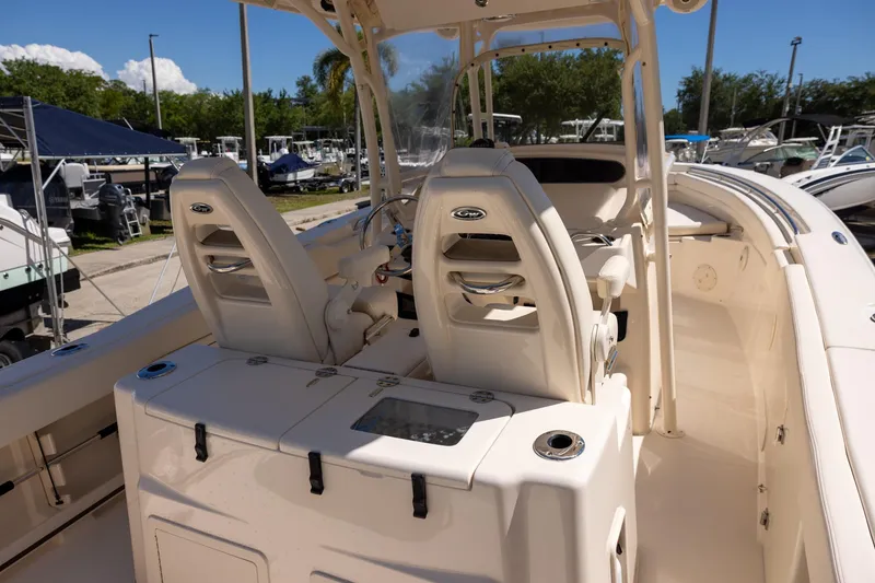 Slide: The Image of 2016 Grady-White Canyon 306 boat interior with helm seats and console. - 8