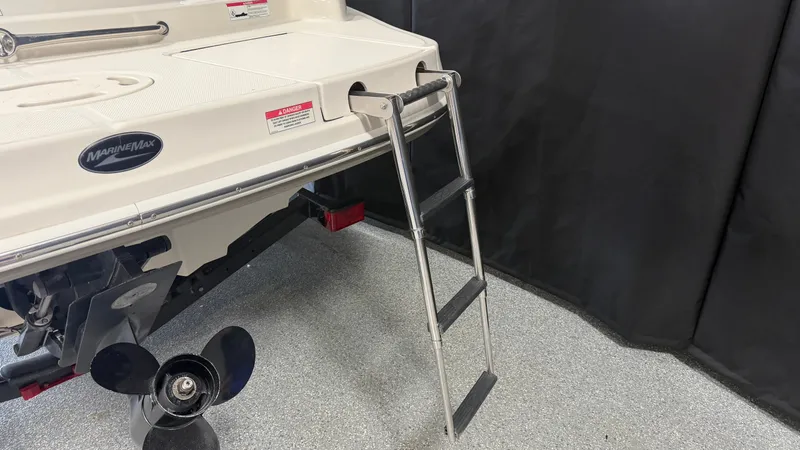 Slide: The Image of A swim platform with a retractable ladder and propeller on a Sea Ray 200 Sundeck boat. - 12
