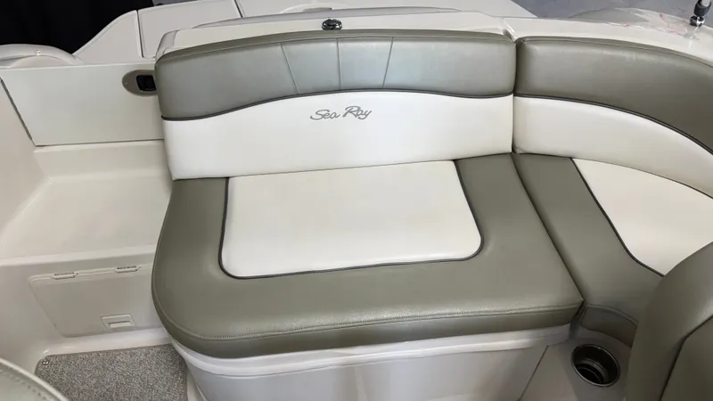 Slide: The Image of The seating area on a 2007 Sea Ray 200 Sundeck features white and gray upholstery. - 20