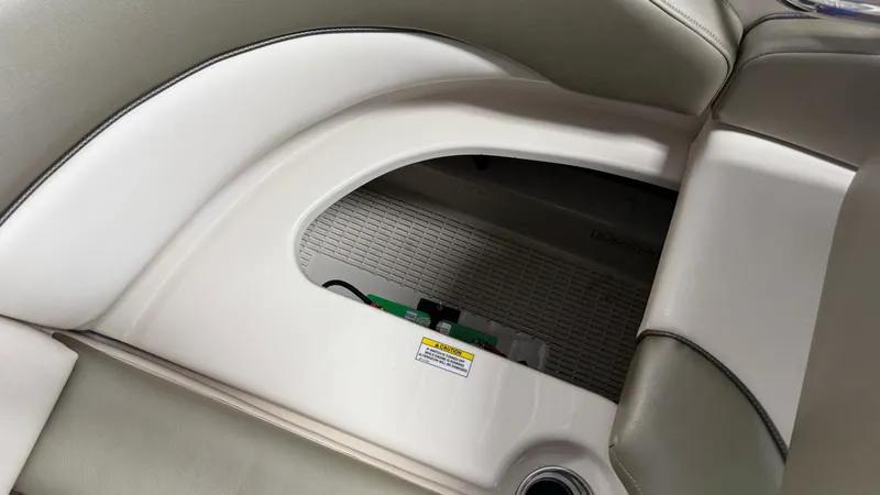 Slide: The Image of A seating area with storage underneath on a 2007 Sea Ray 200 Sundeck boat. - 24