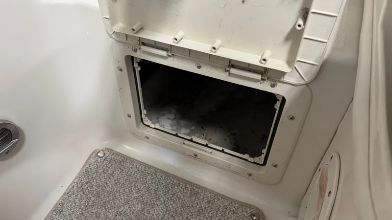 Slide: The Image of An open storage compartment on a 2007 Sea Ray 200 Sundeck boat. - 19