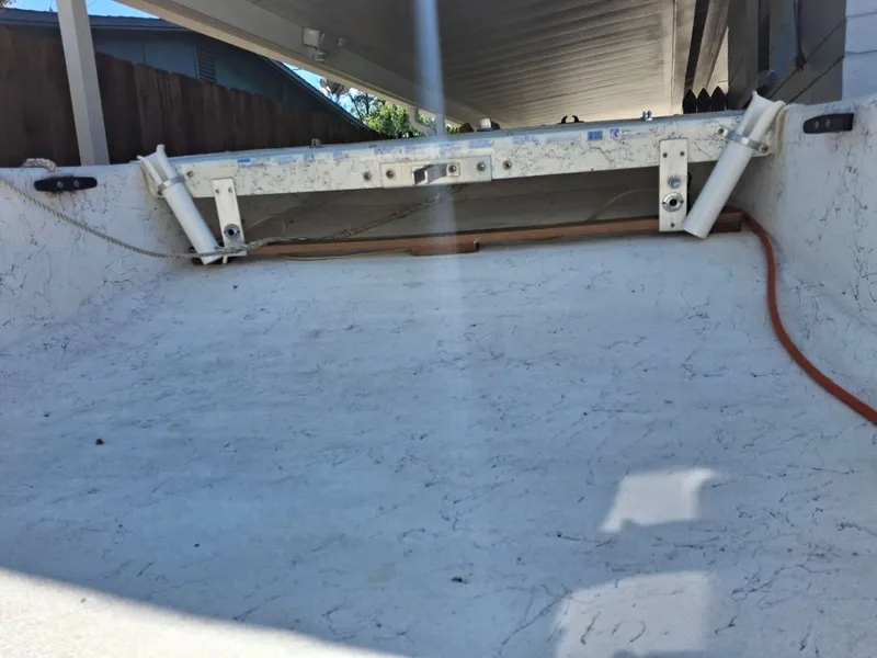 Slide: The Image of 1994 Carolina Skiff J boat hull under a carport. - 10