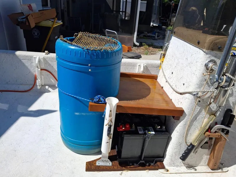 Slide: The Image of 1994 Carolina Skiff J with blue barrel and battery. - 13