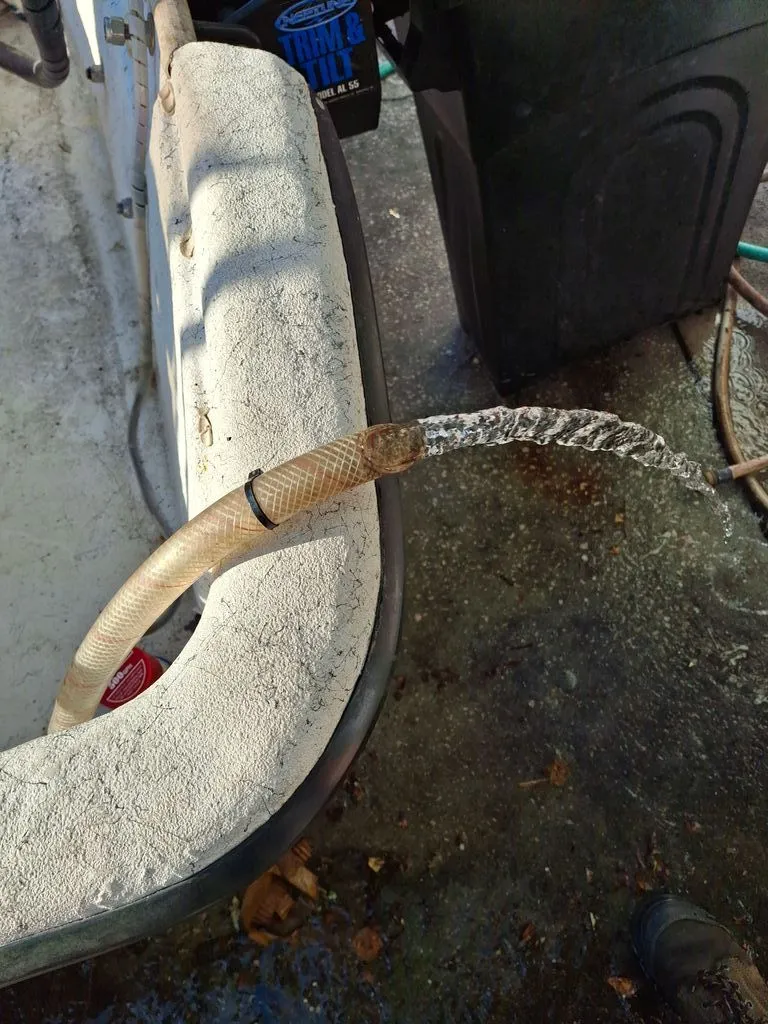 Slide: The Image of Frozen water stream from a hose on a Carolina Skiff boat. - 9