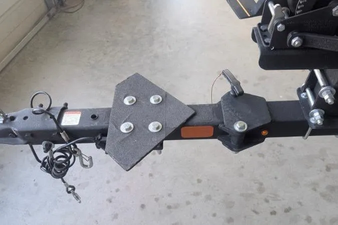 Slide: The Image of Trailer hitch of 2023 Tracker Pro Team 175 TF boat, featuring secure attachments and wiring. - 5