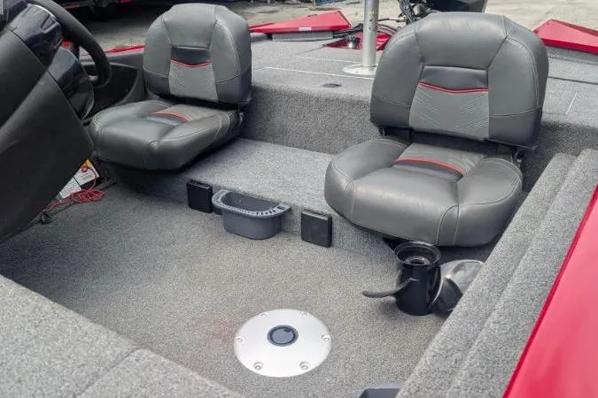 Slide: The Image of 2023 Tracker Pro Team 175 TF boat interior with two gray seats and cup holders. - 8