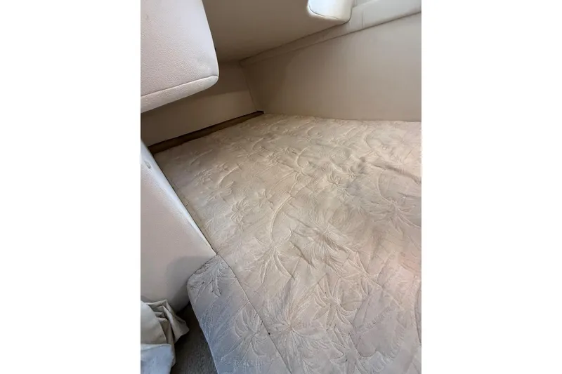 Slide: The Image of Interior cabin view of 2005 Larson Cabrio 240 with beige upholstery. - 11