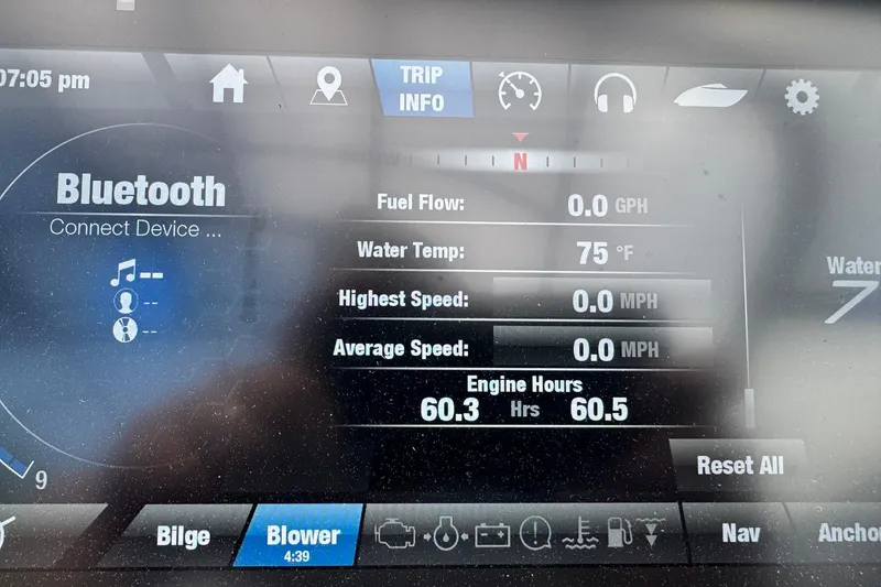 Slide: The Image of Dashboard of 2020 Yamaha Boats 242SE showing Bluetooth, engine hours, and water temperature. - 6