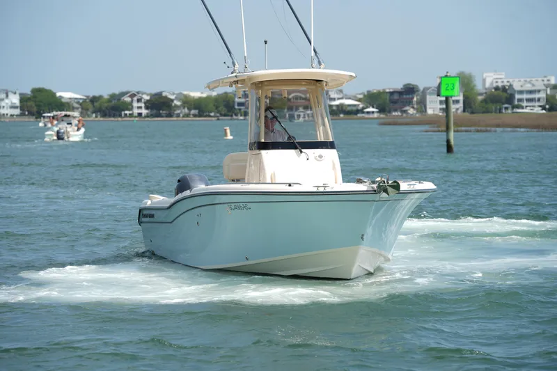Slide: The Image of 2023 Grady-White Fisherman 257 boat cruising on a sunny day in coastal waters. - 10
