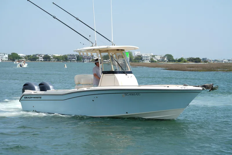 Slide: The Image of 2023 Grady-White Fisherman 257 boat cruising on a sunny day. - 13