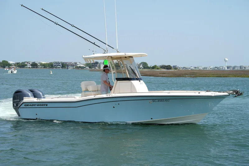 Slide: The Image of 2023 Grady-White Fisherman 257 boat cruising on a sunny day. - 14