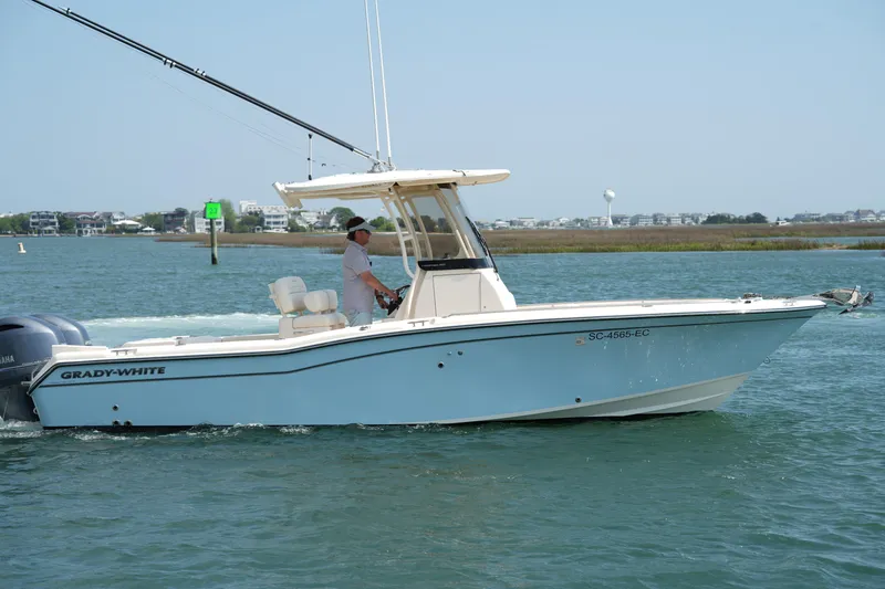 Slide: The Image of 2023 Grady-White Fisherman 257 boat cruising on a sunny day. - 15