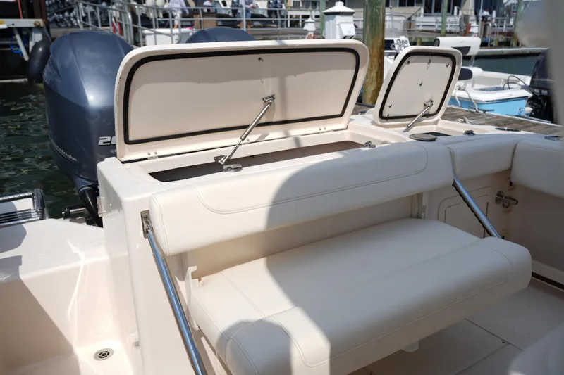 Slide: The Image of 2023 Grady-White Fisherman 257 boat with open storage compartments and seating. - 17