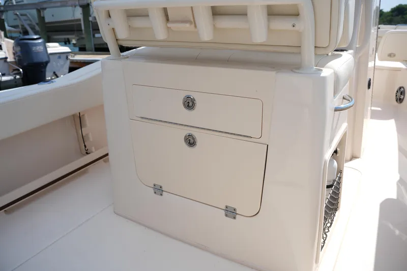 Slide: The Image of 2023 Grady-White Fisherman 257 boat storage compartment with secure locks. - 18