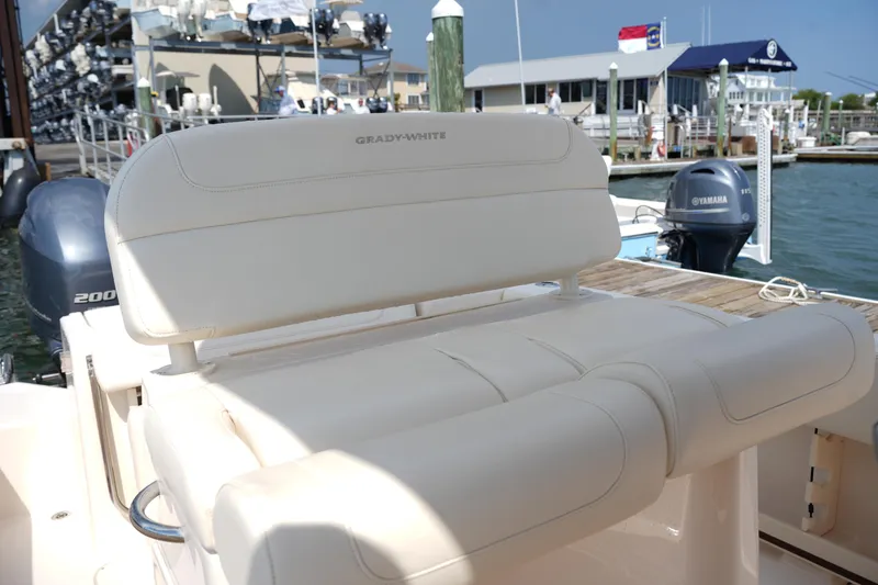 Slide: The Image of 2023 Grady-White Fisherman 257 boat seat at marina with Yamaha outboard motor. - 20