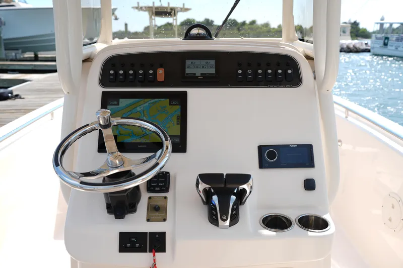 Slide: The Image of 2023 Grady-White Fisherman 257 helm with navigation system and controls. - 21