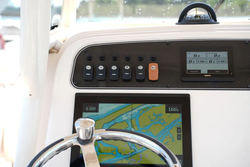 Slide: The Image of Dashboard of 2023 Grady-White Fisherman 257 boat with navigation and control systems. - 22