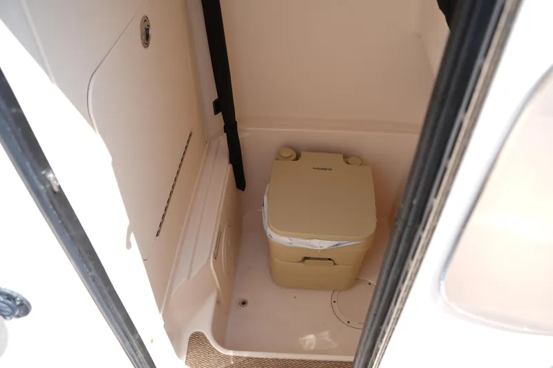 Slide: The Image of 2023 Grady-White Fisherman 257 boat interior with portable toilet. - 28