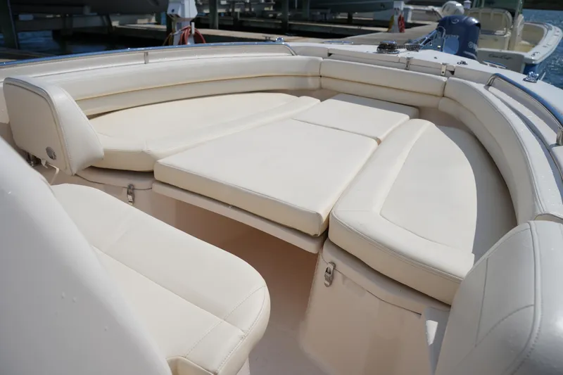 Slide: The Image of 2023 Grady-White Fisherman 257 boat interior with cushioned seating and spacious layout. - 29
