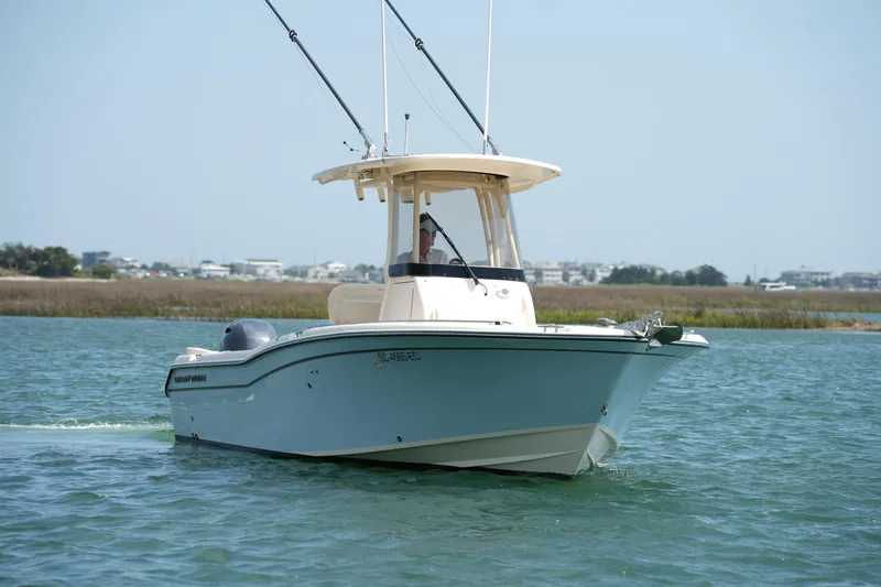 Slide: The Image of 2023 Grady-White Fisherman 257 boat cruising on a calm waterway. - 3